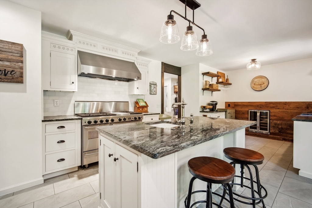 108 Berwick Road Longmeadow, MA 01106 - Photo 2 of 42 a kitchen with stainless steel appliances granite countertop a stove and cabinets