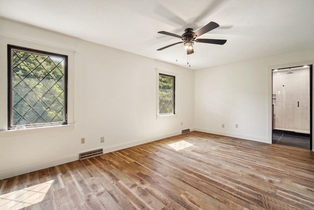 108 Berwick Road Longmeadow, MA 01106 - Photo 22 of 42 a view of an empty room with wooden floor and a window