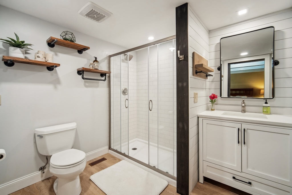 108 Berwick Road Longmeadow, MA 01106 - Photo 36 of 42 a bathroom with a toilet sink and shower a mirror