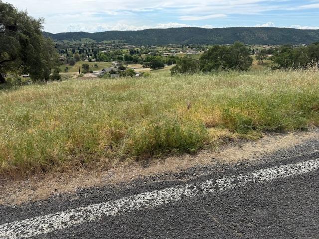 2648 Arrowhead Street Copperopolis, CA 95228 - Photo 9 of 10 a view of a lake with mountains in the background