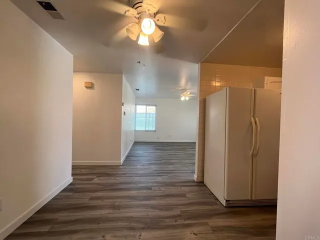 a kitchen with a stove microwave and cabinets