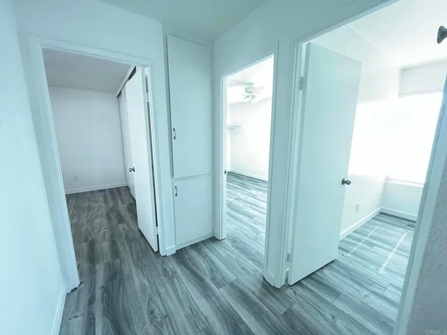 a bathroom with a granite countertop toilet a sink and shower