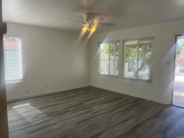 a view of a house with backyard porch and sitting area