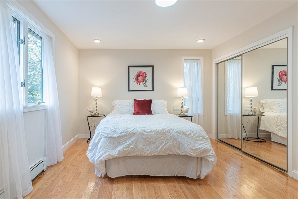 57 Town Farm Road Brookfield, MA 01506 - Photo 24 of 38 a bedroom with a large bed and a window