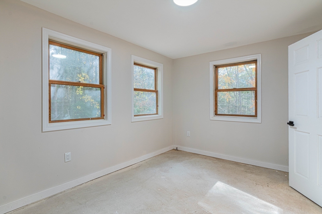 57 Town Farm Road Brookfield, MA 01506 - Photo 32 of 38 a view of an empty room with windows