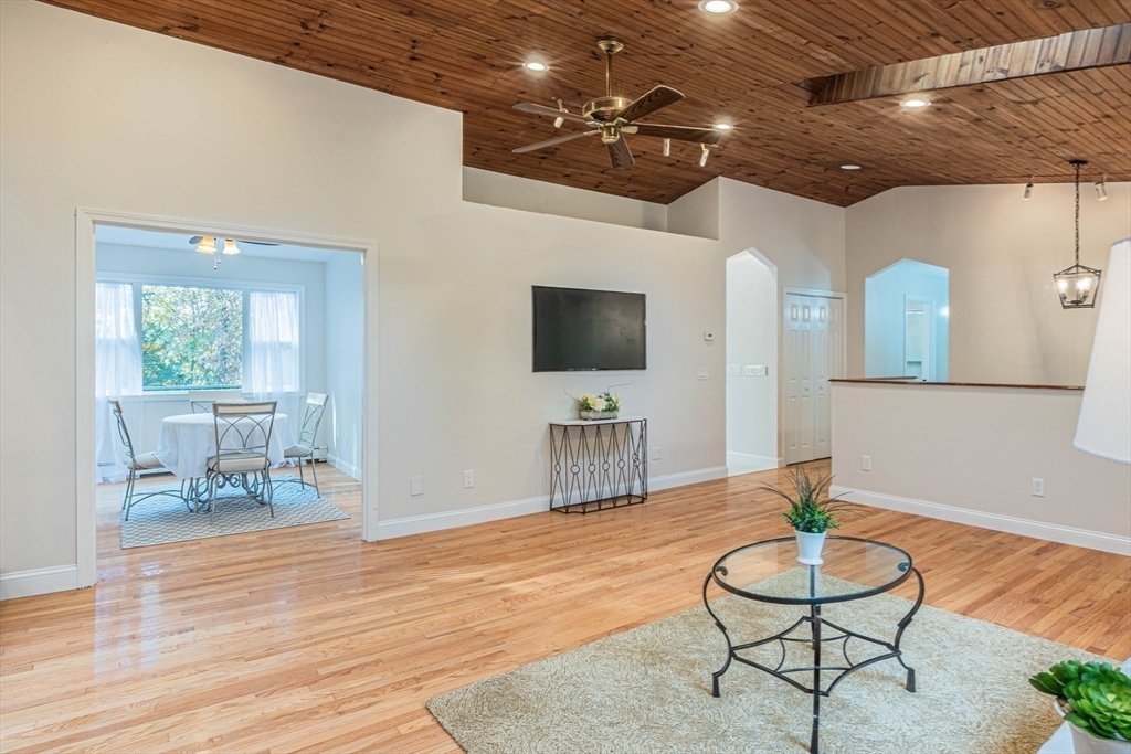 57 Town Farm Road Brookfield, MA 01506 - Photo 10 of 38 a living room with furniture and a flat screen tv