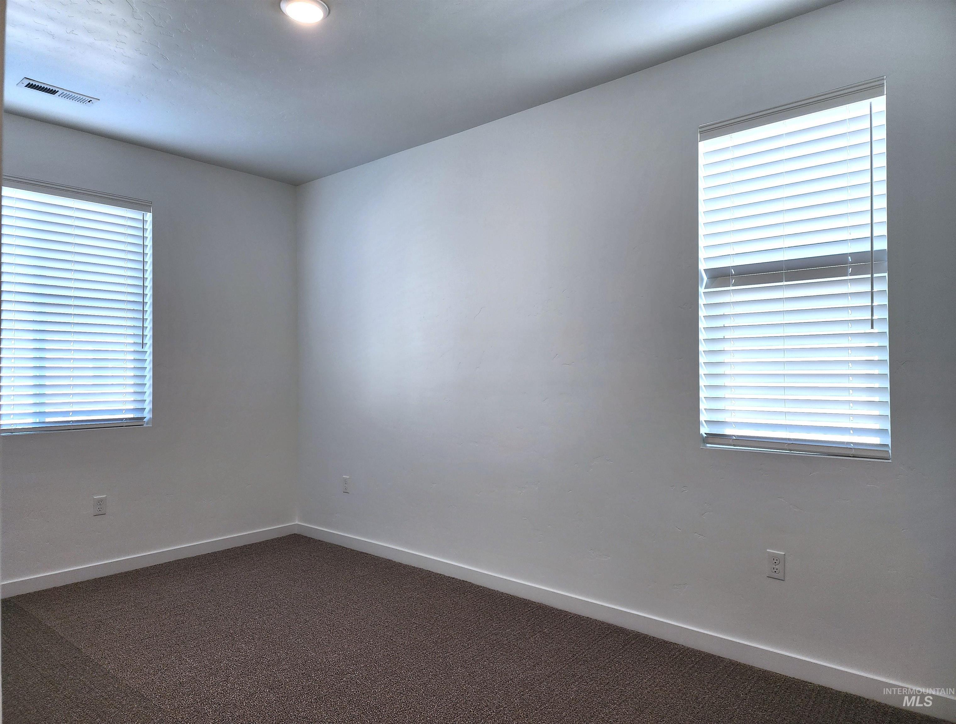 362 North Lagrasse Lane Star, ID 83669 - Photo 13 of 16 Unfurnished room with dark carpet and baseboards