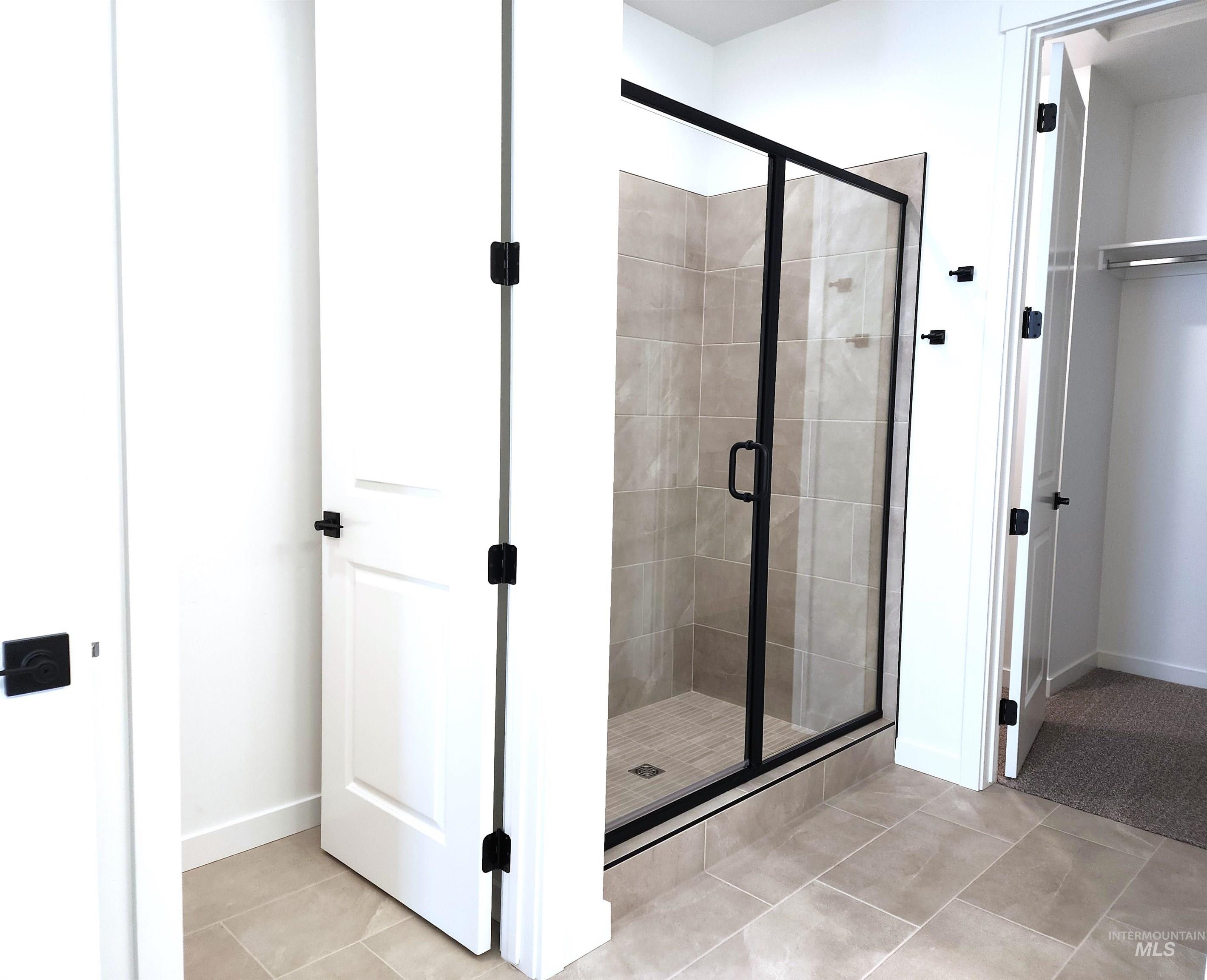362 North Lagrasse Lane Star, ID 83669 - Photo 8 of 16 Full bathroom with a shower stall and light tile patterned floors