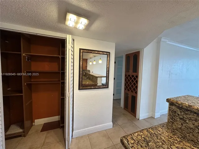 a living room with a couch and a dresser