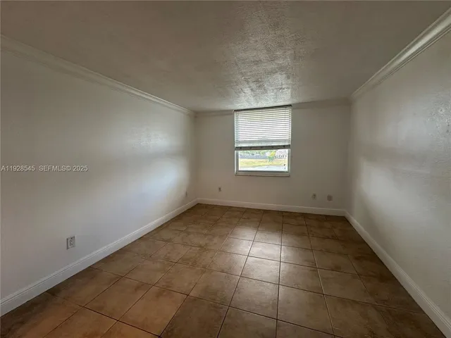 an empty room with a empty space and window