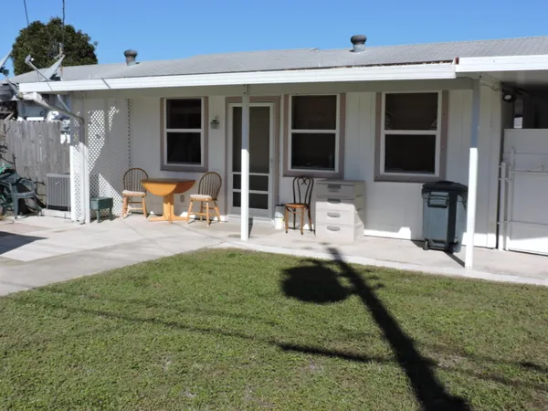 a view of swimming pool with outdoor seating