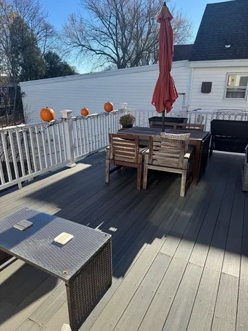 a balcony view with a seating space