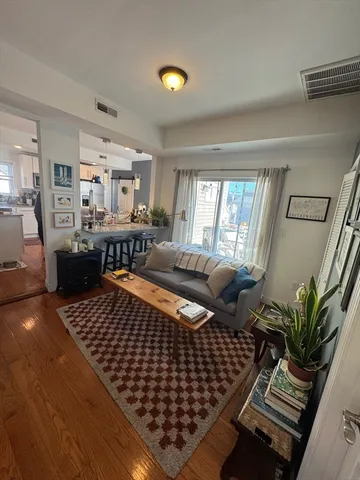 a bedroom with furniture window and wooden floor