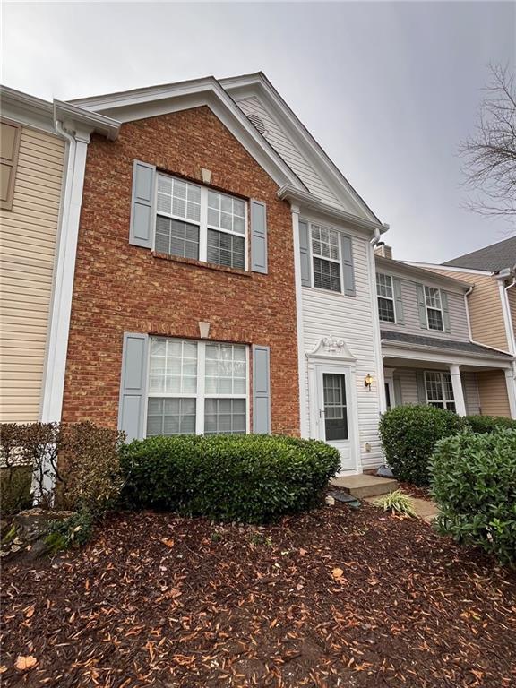 5764 Reps Trace Norcross, GA 30071 - Photo 12 of 25 a front view of a house with a garden