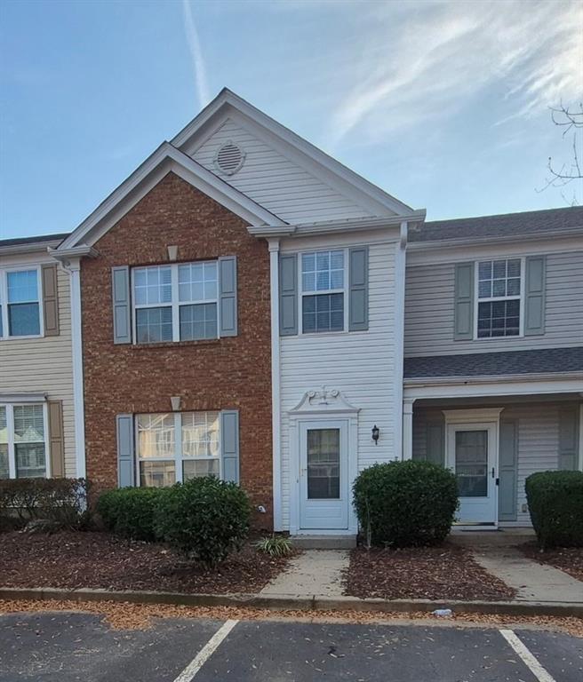 5764 Reps Trace Norcross, GA 30071 - Photo 13 of 25 a front view of a house with a yard