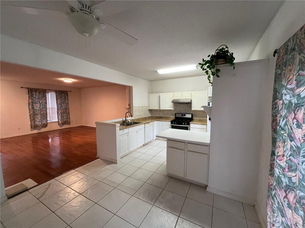 5764 Reps Trace Norcross, GA 30071 - Photo 18 of 25 a kitchen with granite countertop a refrigerator and a stove top oven