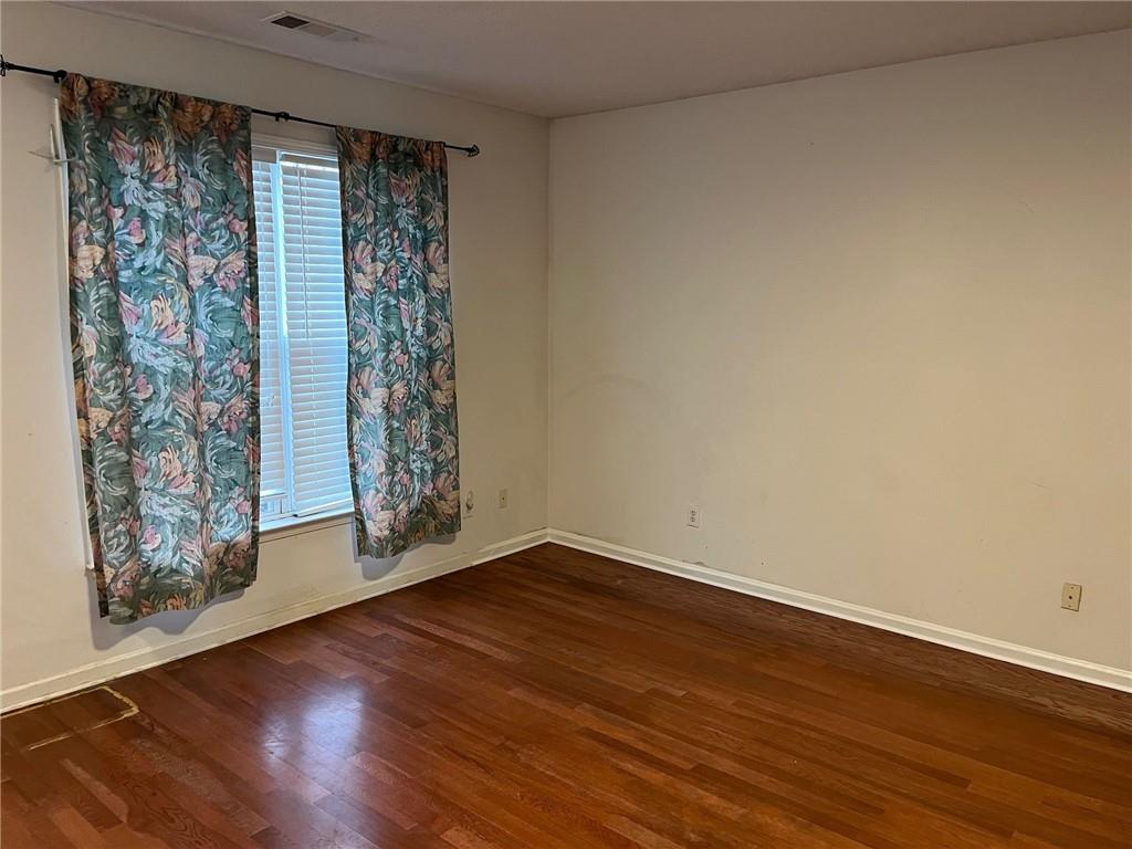 5764 Reps Trace Norcross, GA 30071 - Photo 9 of 25 a view of room with window and hardwood