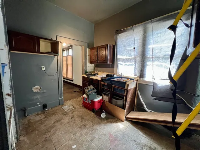 a bedroom with furniture and a mirror