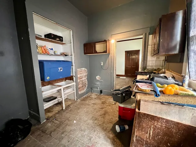 a bedroom with a bed and a flat tv screen