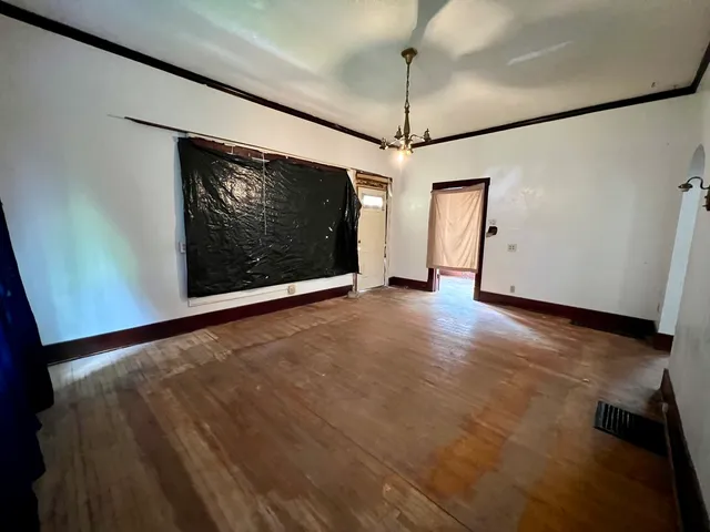 a view of an empty room with a fireplace