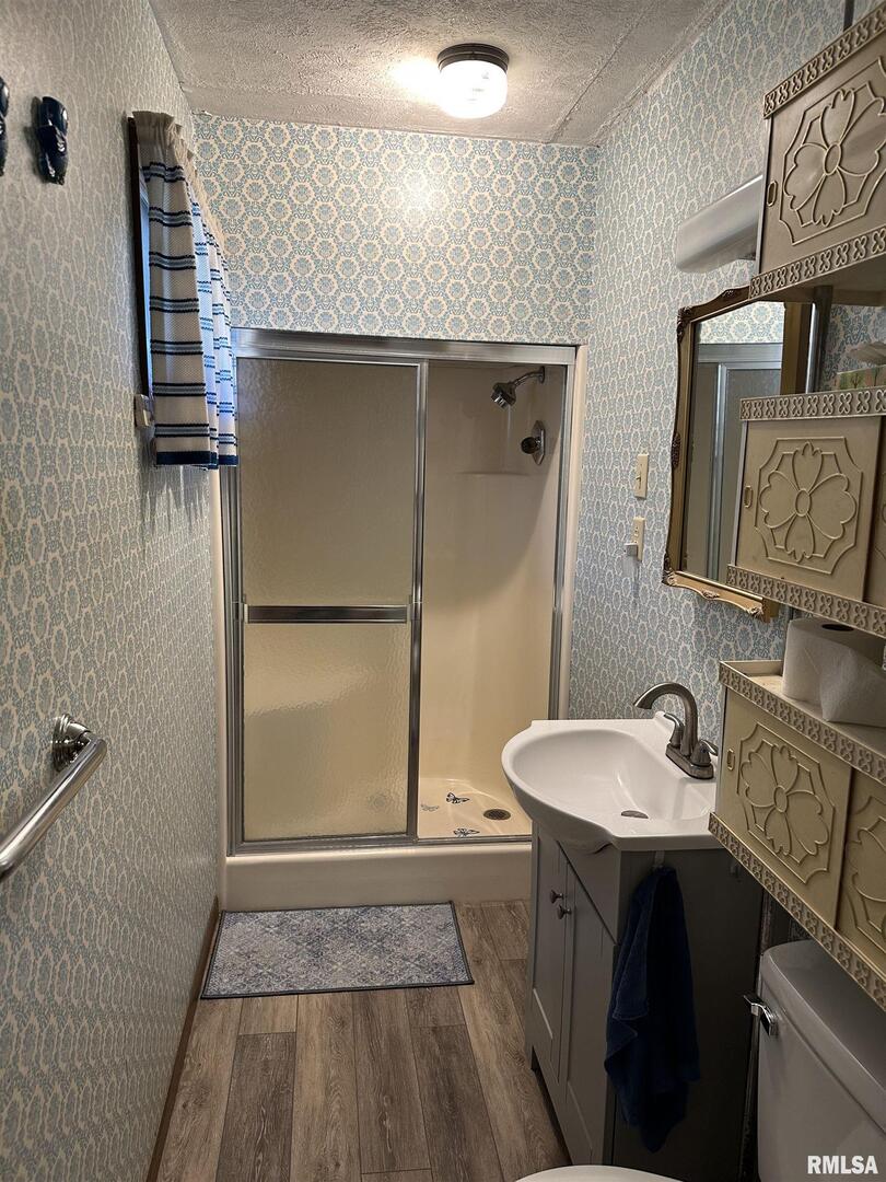 7863 Idyle Wild Road Du Quoin, IL 62832 - Photo 16 of 18 a bathroom with a sink and a mirror