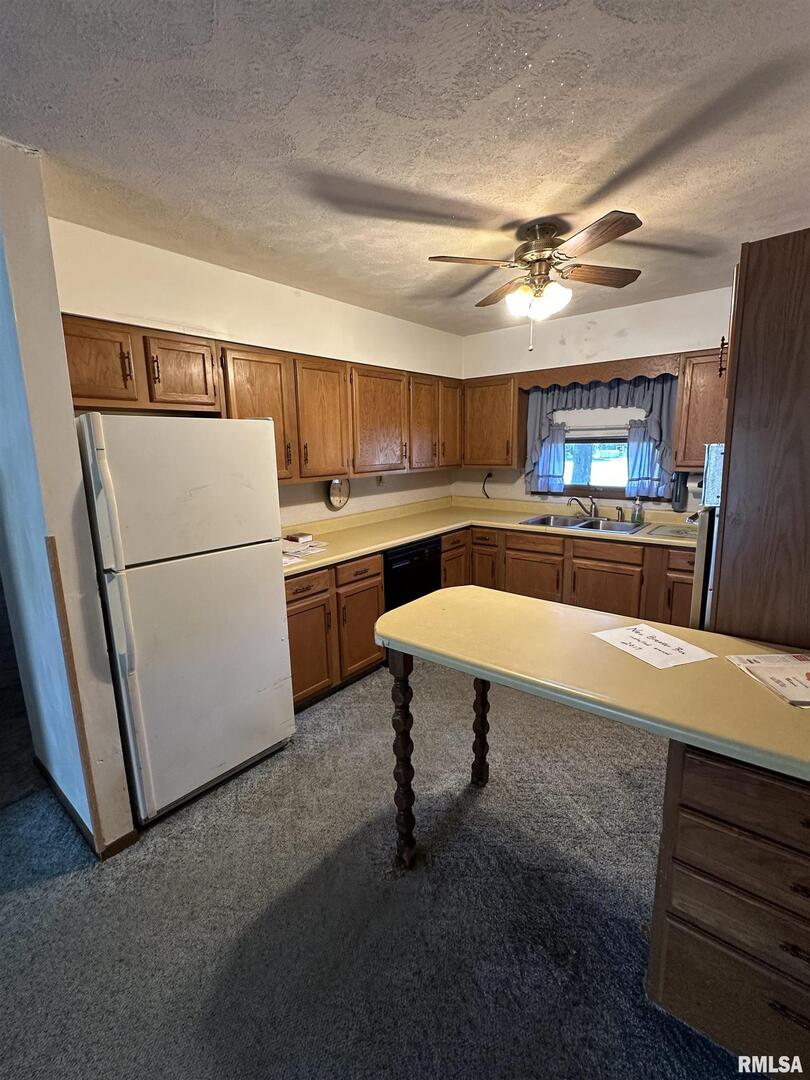 7863 Idyle Wild Road Du Quoin, IL 62832 - Photo 10 of 18 a kitchen with stainless steel appliances granite countertop a refrigerator and a stove top oven