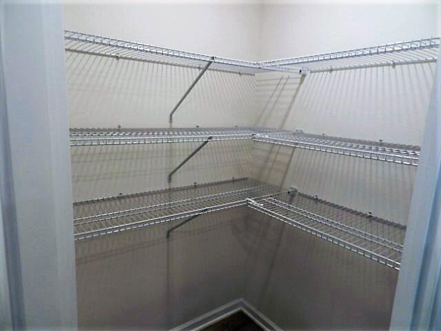 4605 Naval Court Crestview, FL 32539 - Photo 9 of 41 a view of a room with racks on the wall