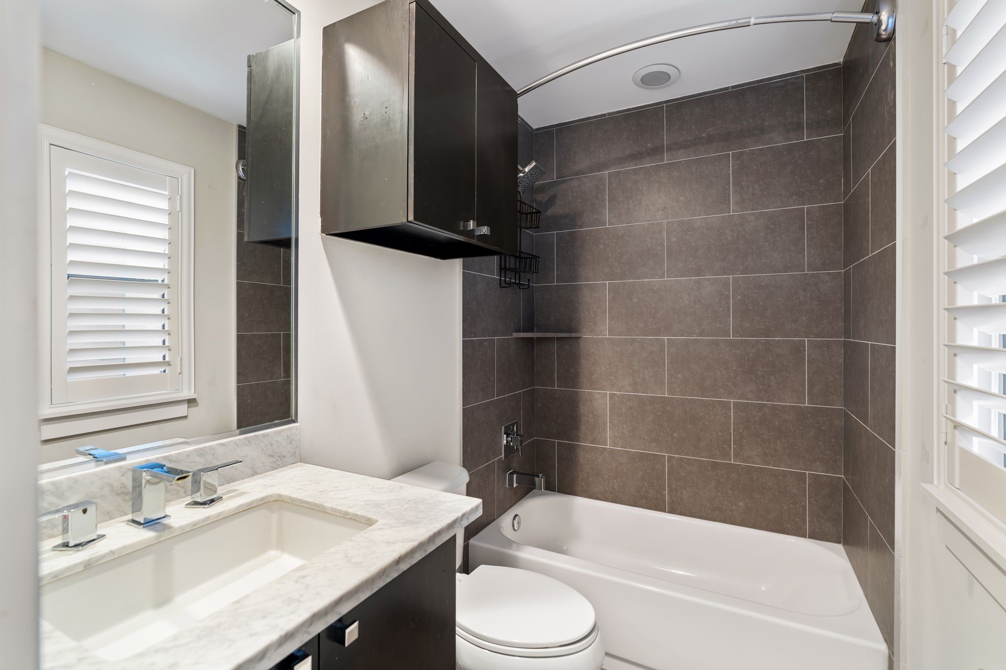 5911 Rose Street Houston, TX 77007 - Photo 10 of 40 First Floor en-suite with modern vanities, sleek finishes, and clean, timeless design.