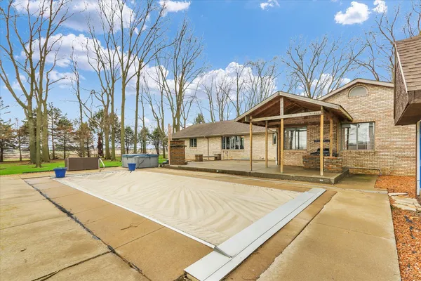 a view of swimming pool with an outdoor space and seating area