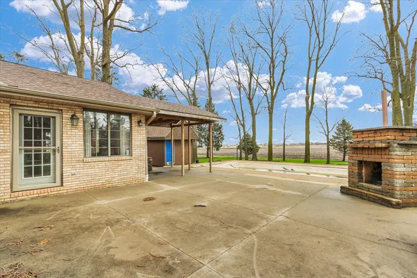 a view of a hall with wooden floor
