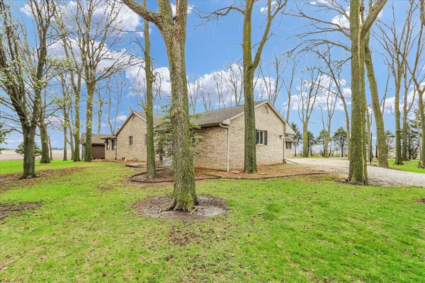 a view of a house with a yard
