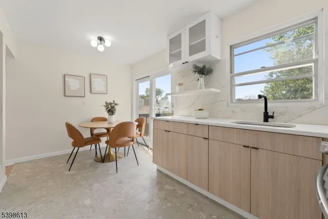 a view of a dining room with furniture and window