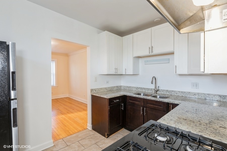 10981 South Church Street, Unit 3B Chicago, IL 60643 - Photo 4 of 8 a kitchen with a sink and cabinets