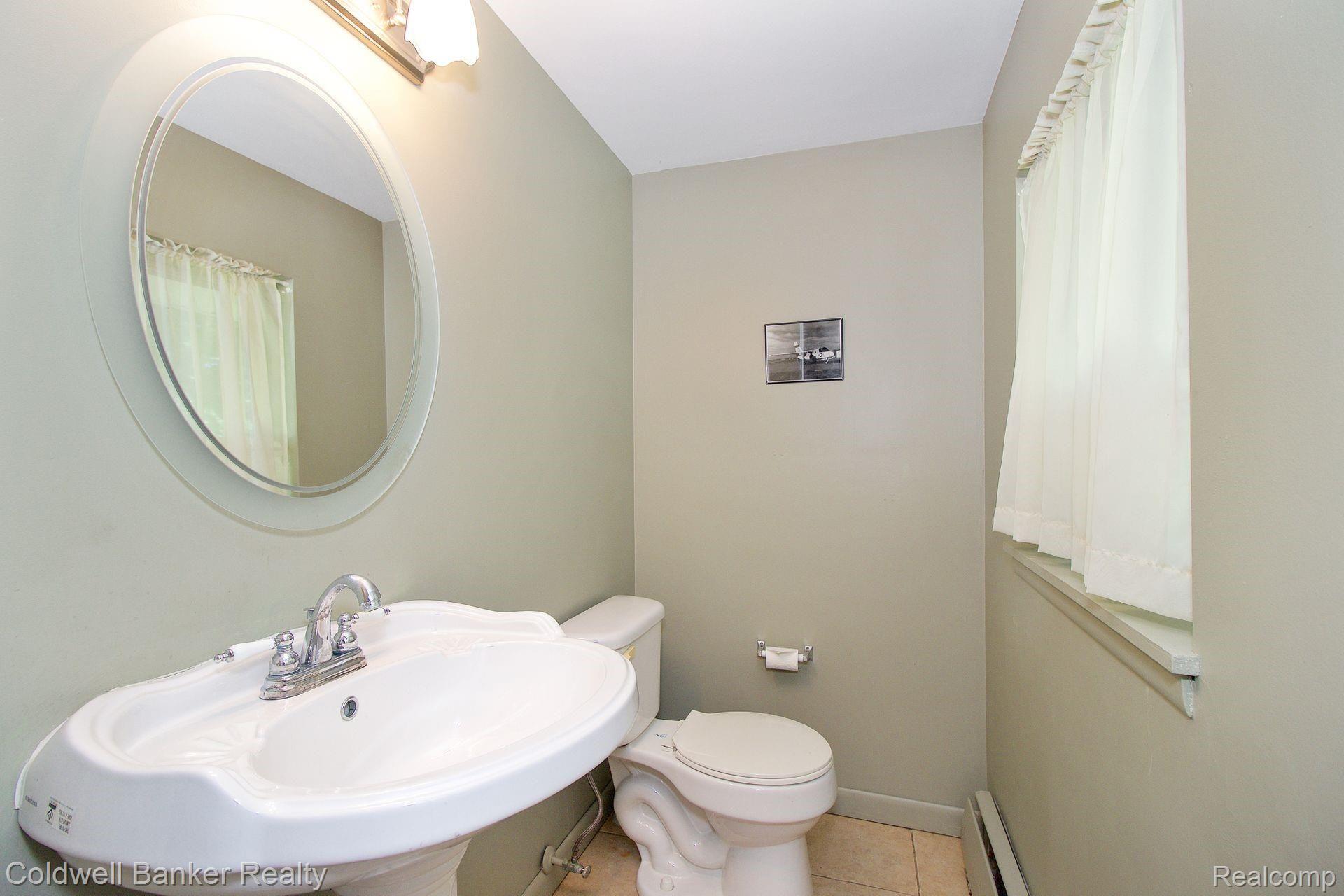 1839 Middle Trail Road Walled Lake, MI 48390 - Photo 16 of 21 Updated Half Bathroom