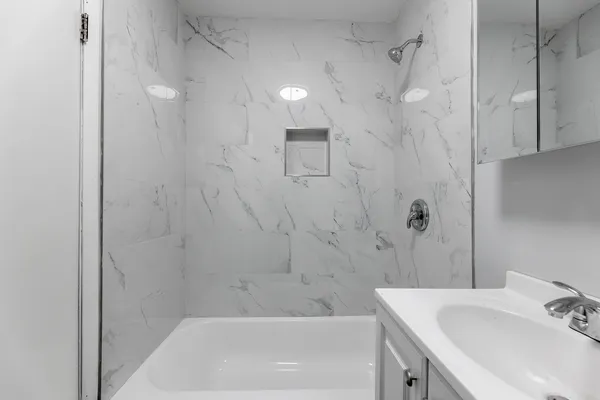 a bathroom with a sink and a bathtub