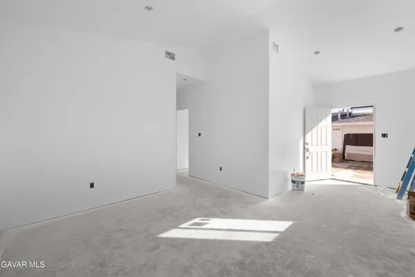 a view of a livingroom with a white walls