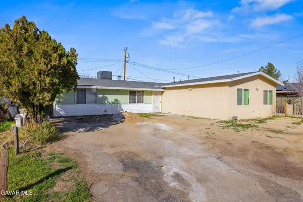 a house view with a backyard space