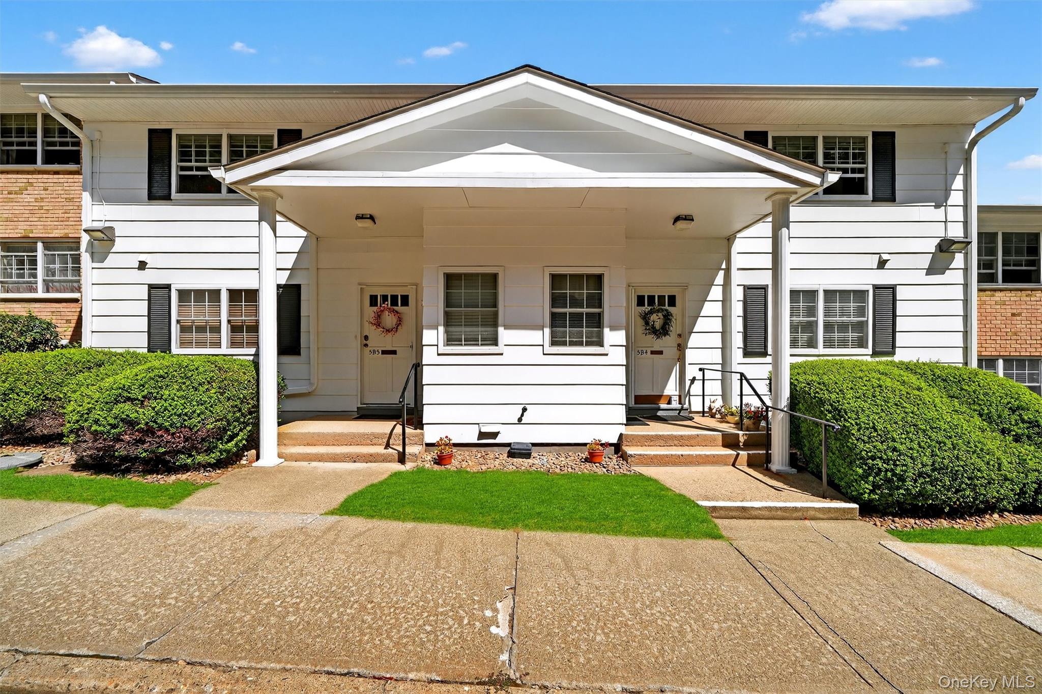 front view of a house with a small yard