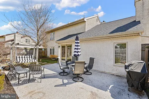 a view of a patio with a table and chairs