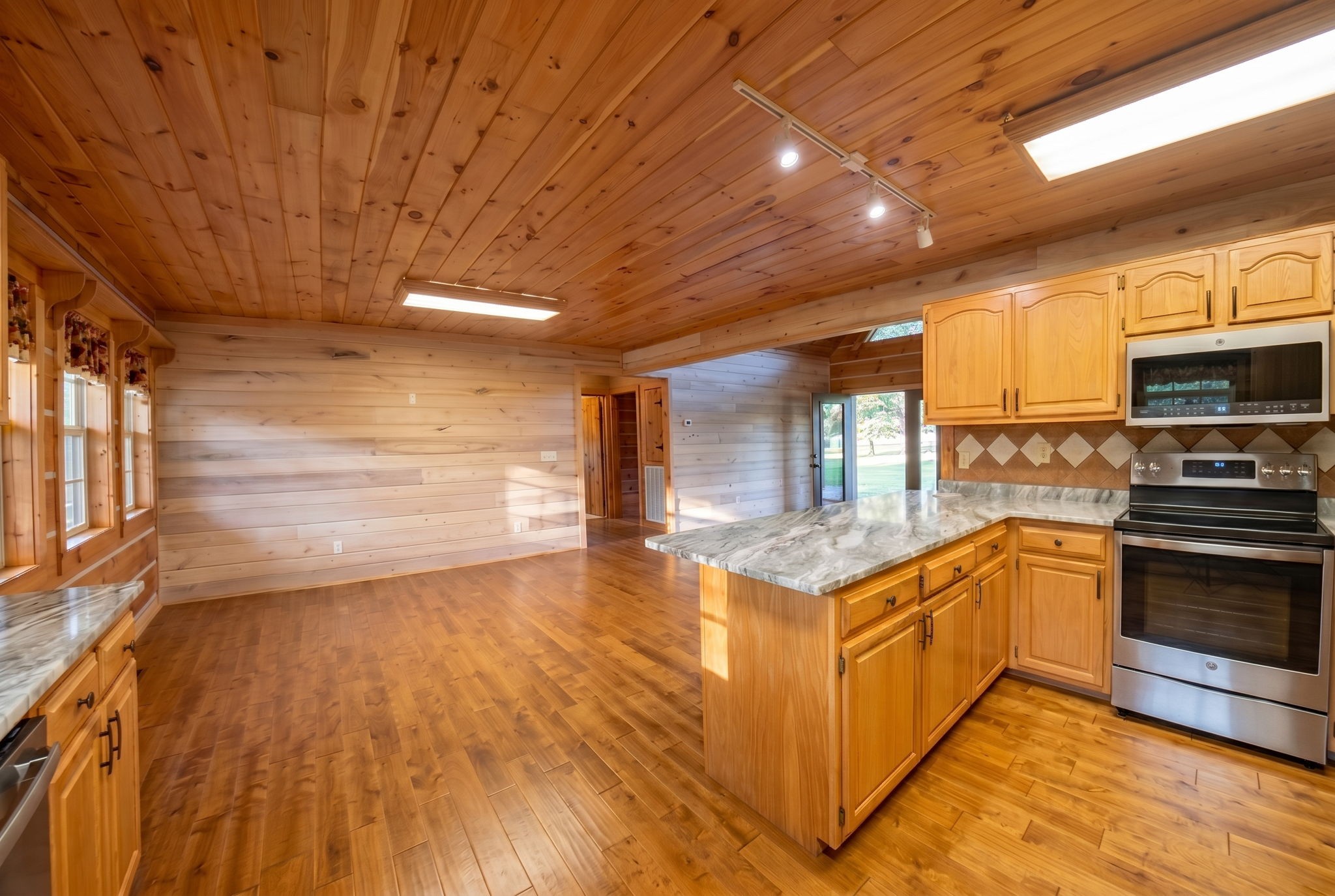 2909 B Beech Log Road Watertown, TN 37184 - Photo 5 of 67 a kitchen with stainless steel appliances granite countertop a stove and a refrigerator