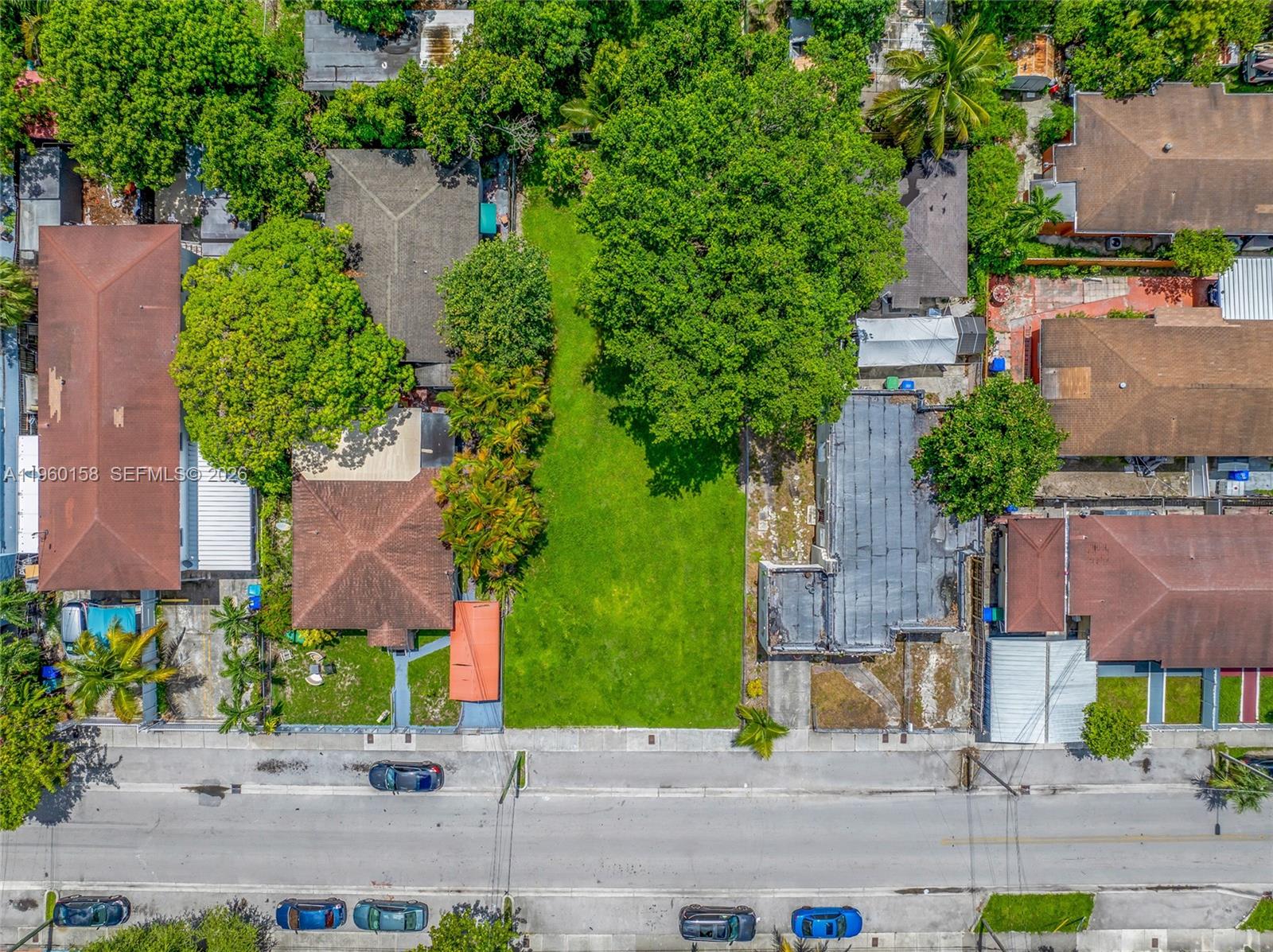 1376 Northwest 32nd Street Miami, FL 33142 - Photo 13 of 15 an aerial view of a house with a garden and plants