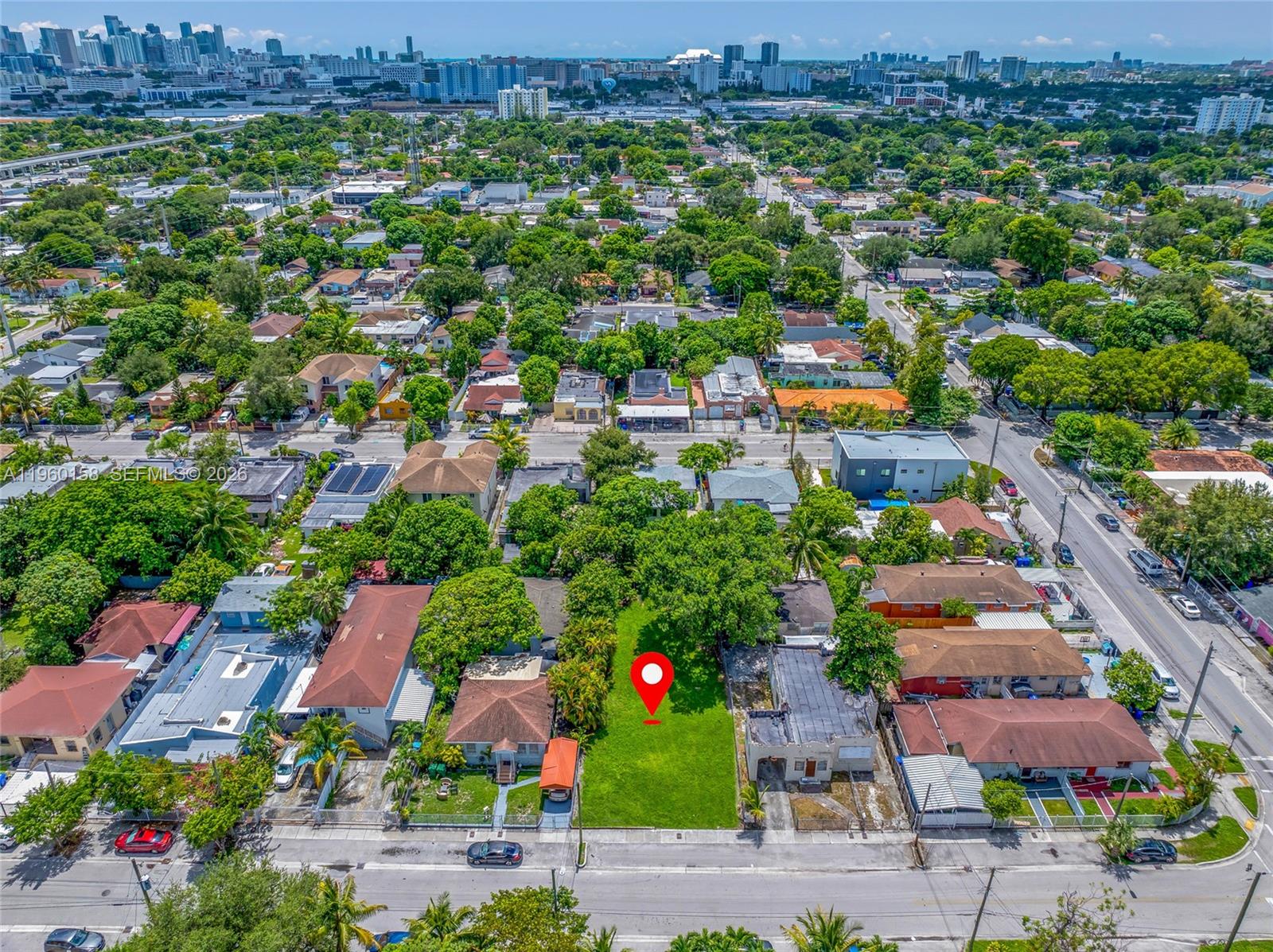 1376 Northwest 32nd Street Miami, FL 33142 - Photo 10 of 15 an aerial view of residential house with outdoor space and lake view