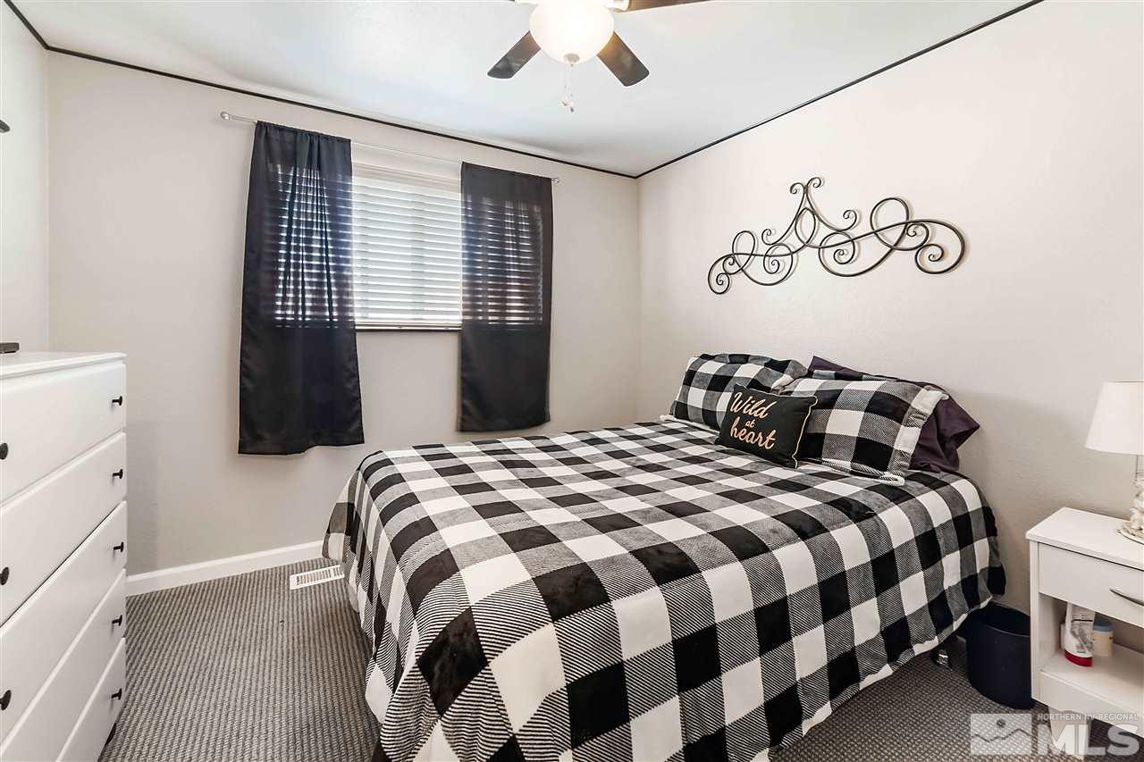 6806 Flower Street Reno, NV 89506 - Photo 20 of 26 a bedroom with a bed and a window