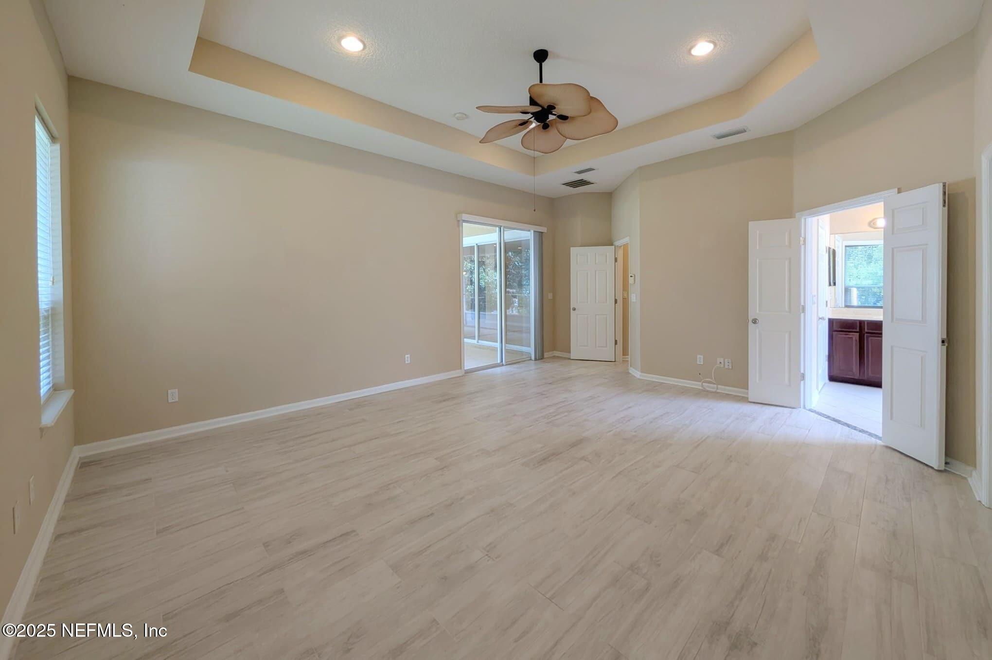 5871 Brush Hollow Road Jacksonville, FL 32258 - Photo 12 of 40 a view of a livingroom with a ceiling fan and window