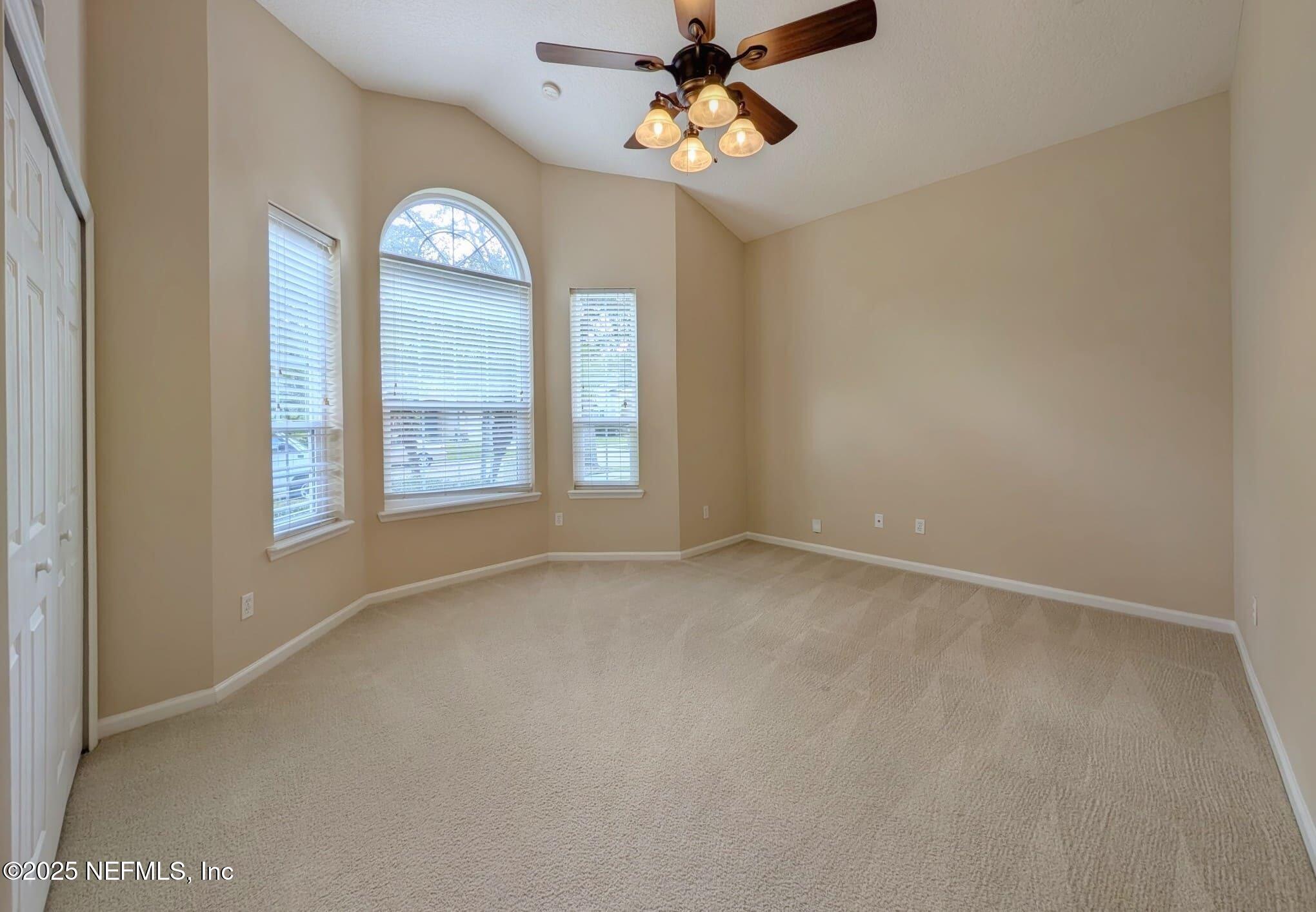5871 Brush Hollow Road Jacksonville, FL 32258 - Photo 15 of 40 an empty room with a window and a fan