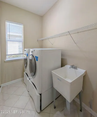 a utility room with dryer and washer