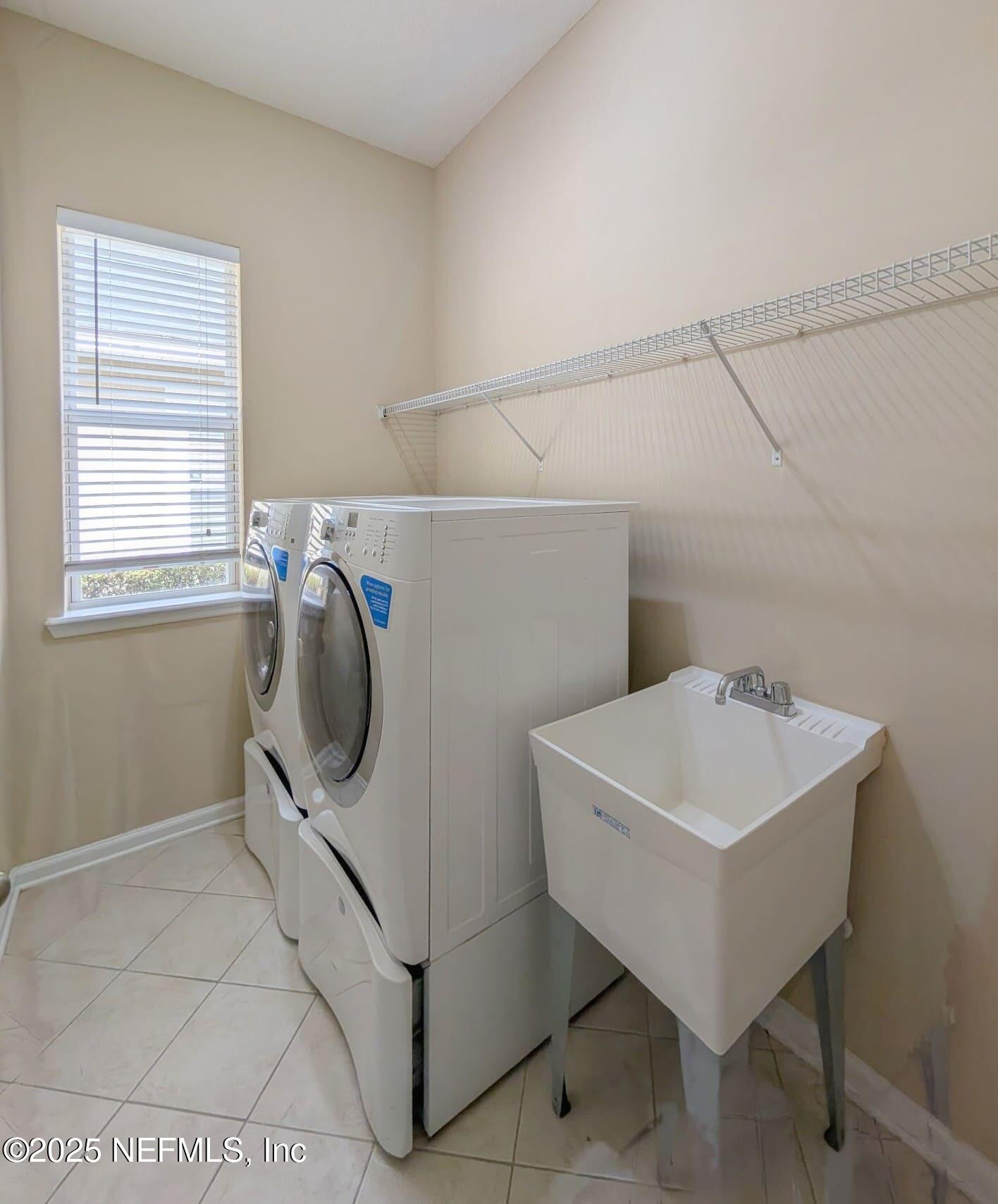 5871 Brush Hollow Road Jacksonville, FL 32258 - Photo 20 of 40 a utility room with dryer and washer