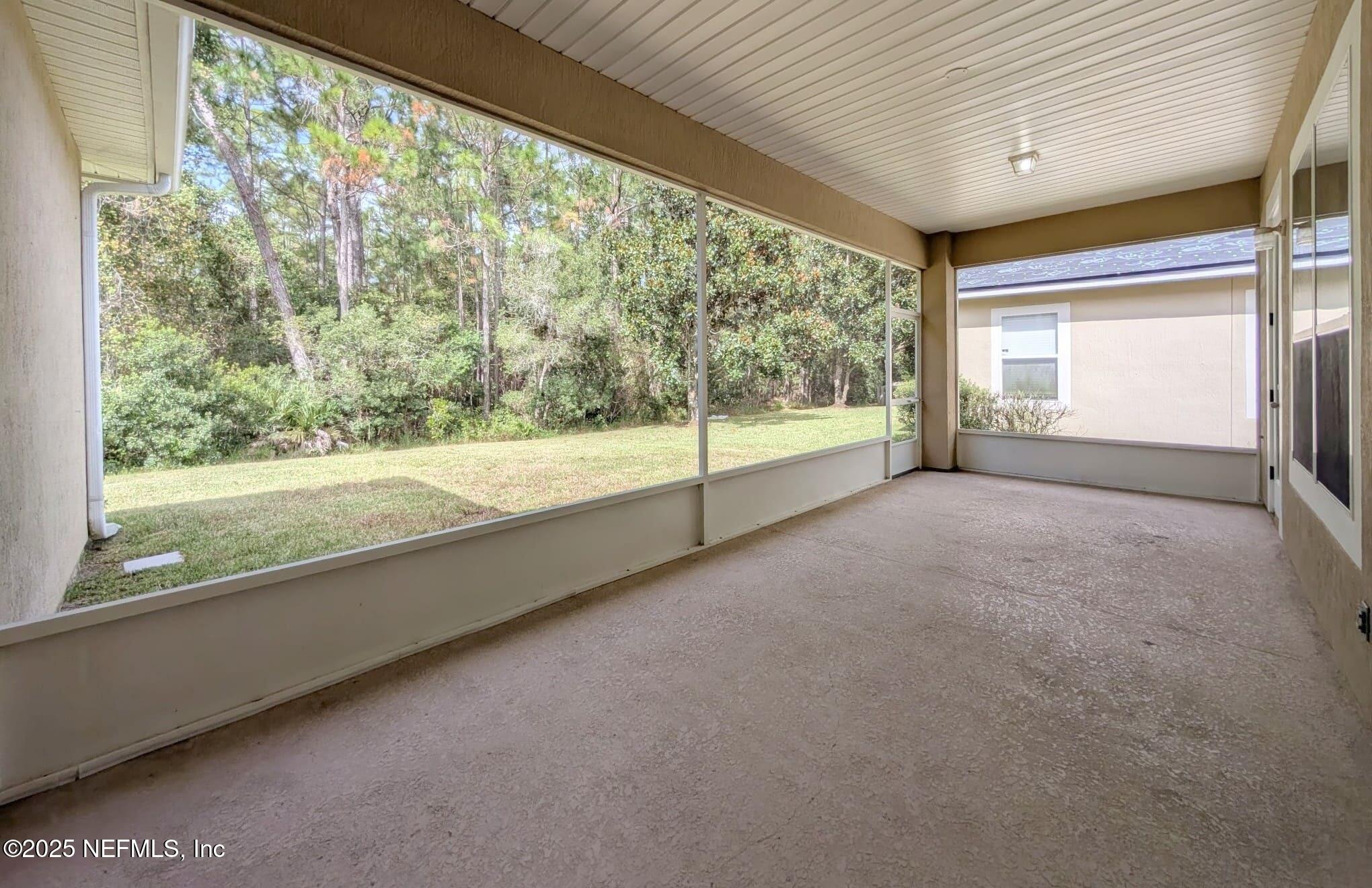 5871 Brush Hollow Road Jacksonville, FL 32258 - Photo 22 of 40 a view of a room with large windows