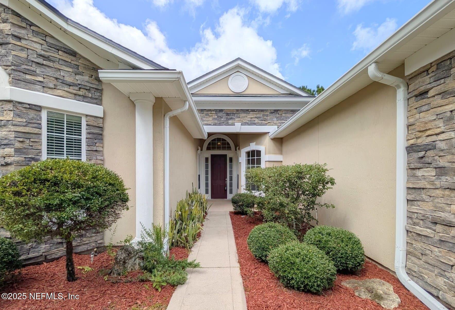 5871 Brush Hollow Road Jacksonville, FL 32258 - Photo 26 of 40 a view of a house with potted plants