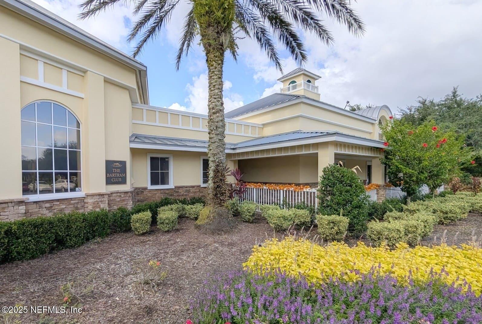 5871 Brush Hollow Road Jacksonville, FL 32258 - Photo 29 of 40 a front view of a house with a yard and potted plants